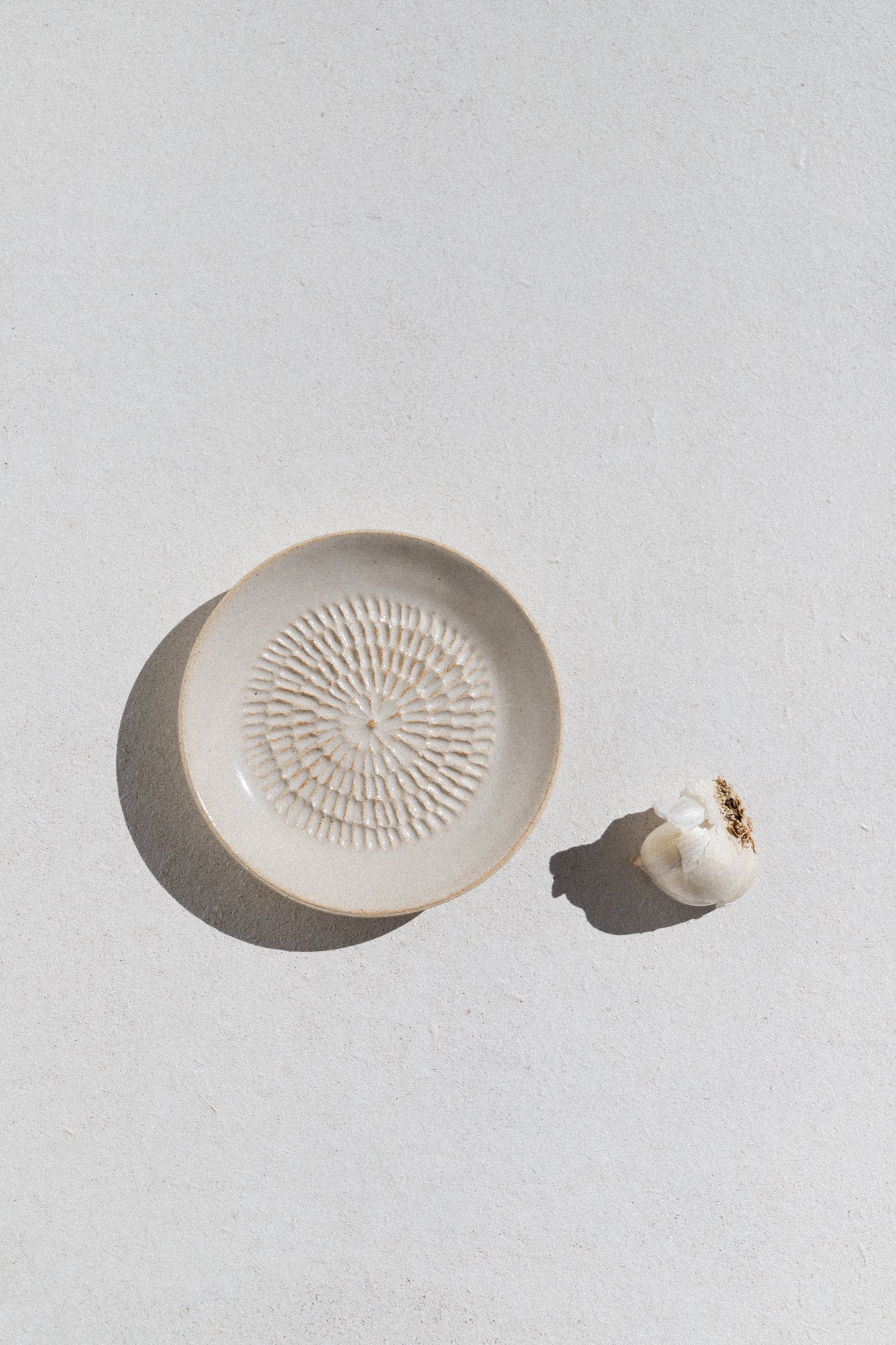 Kura studio ceramic garlic grater in ivory. From Maker's Mrkt Makers Market Melbourne