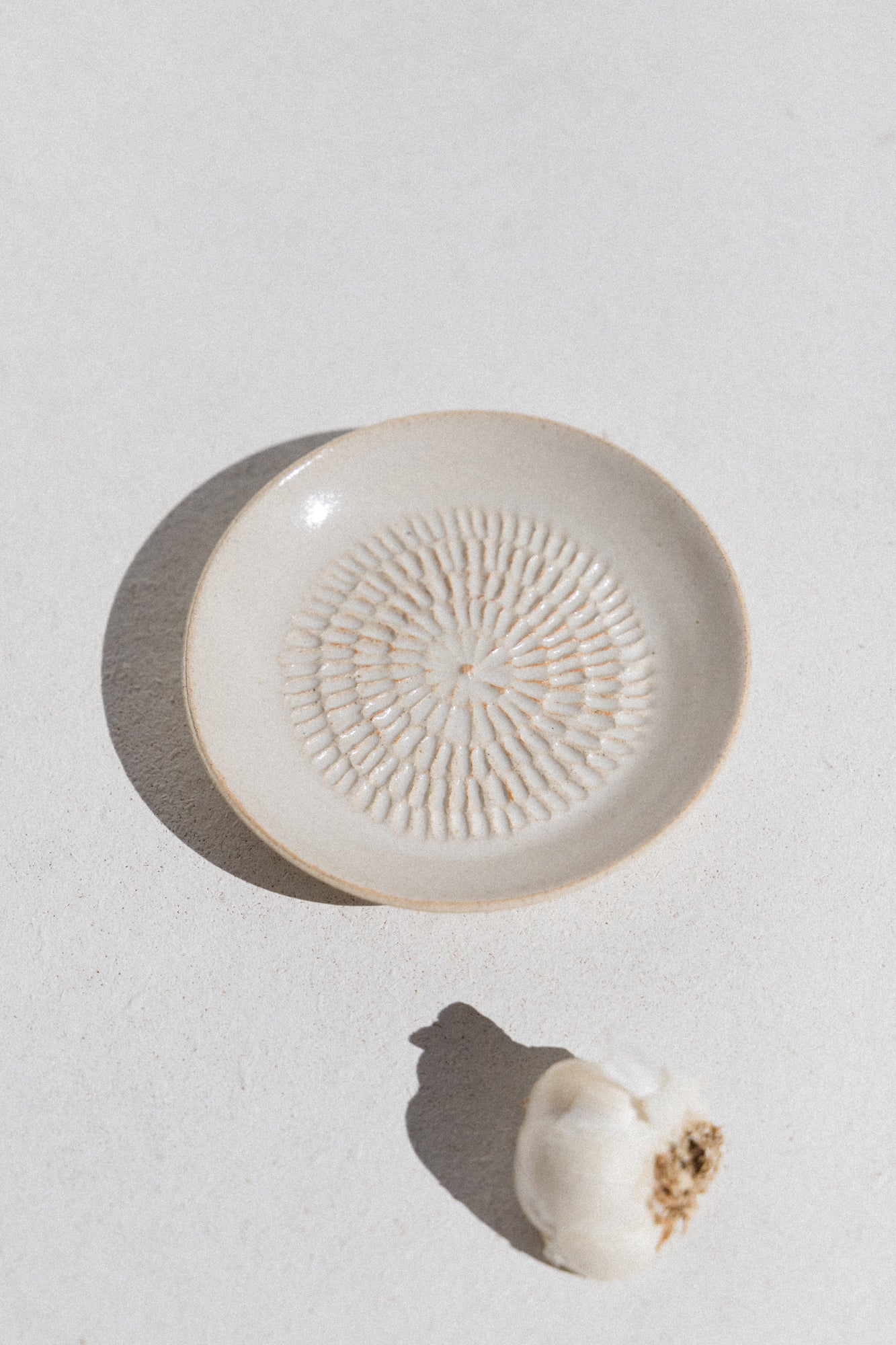 Kura studio ceramic garlic grater in ivory. From Maker's Mrkt Makers Market Melbourne